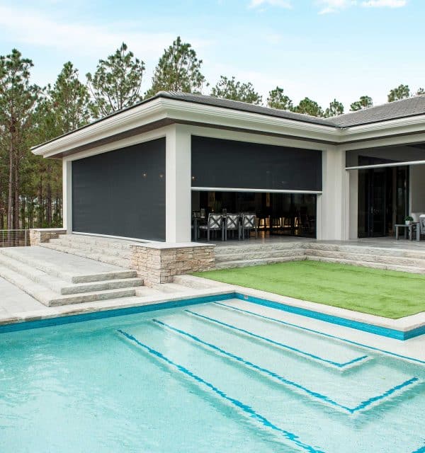 product phantom screens retractable patio screens a swimming pool outside of a house