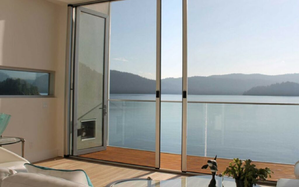 product wizard screens our screen doors a room with a large window and a body of water