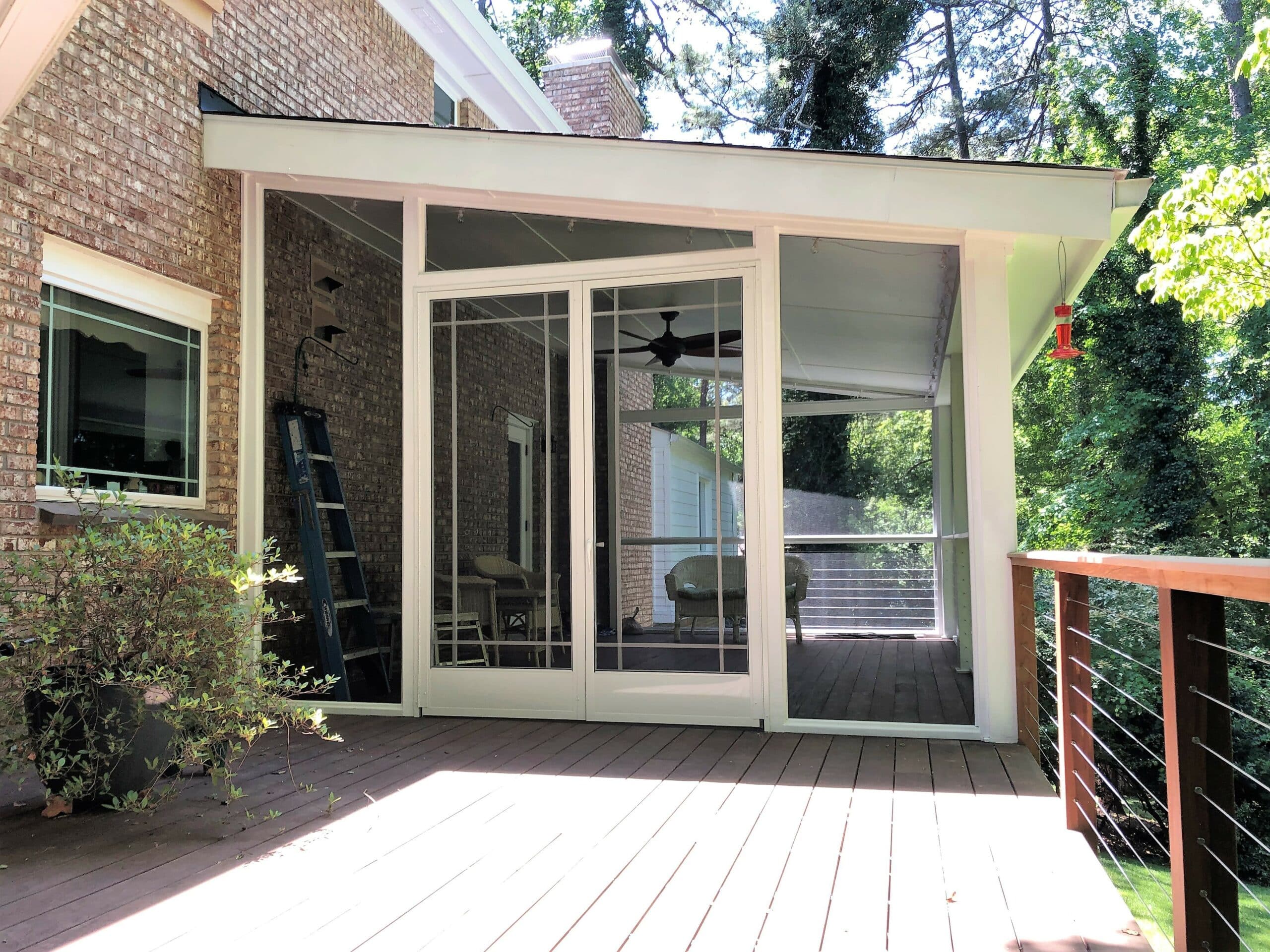 swinging screen doors a house with a glass door